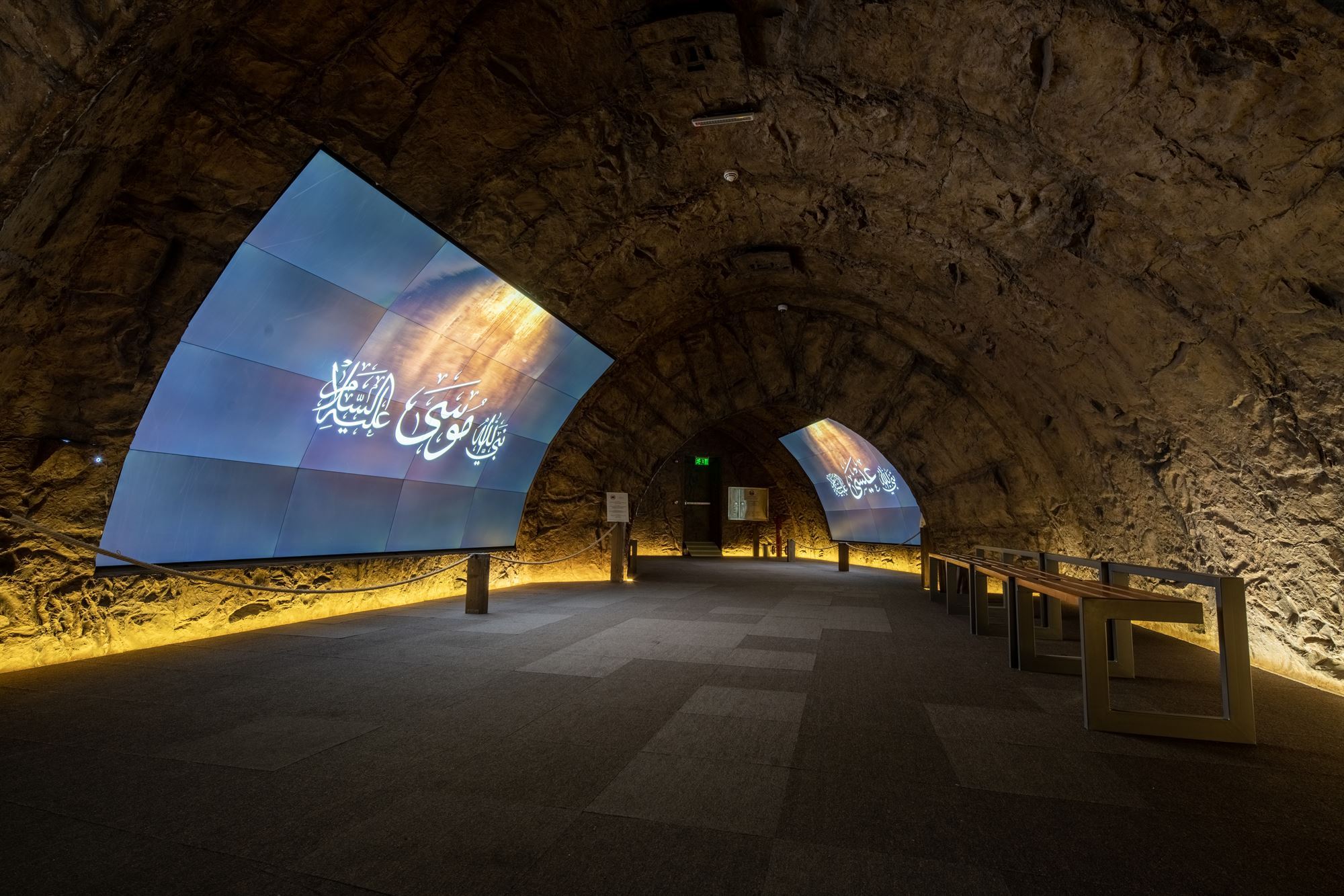 Interactive curved screens displaying the stories of Prophets inside the Revelation Exhibition in Makkah.